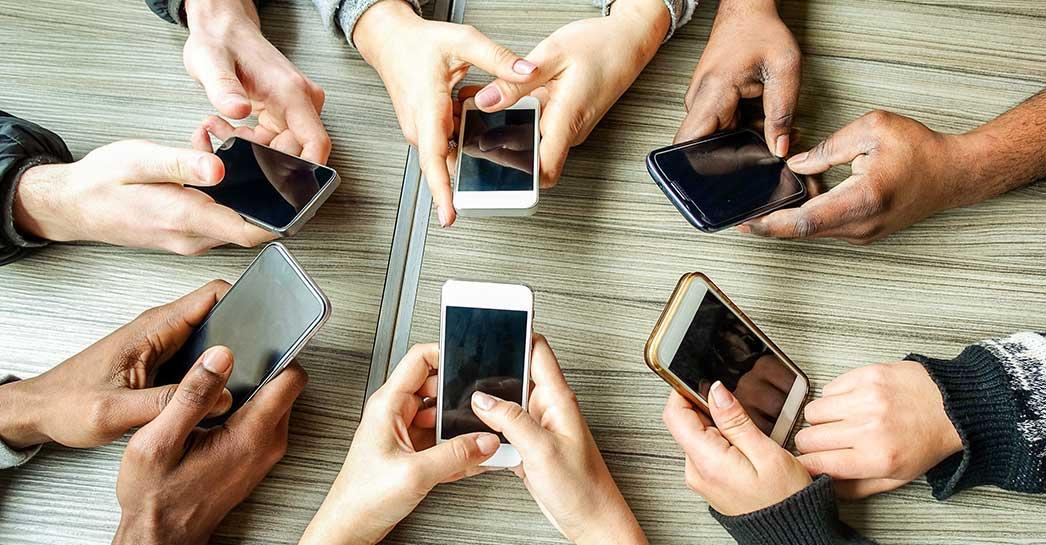 hands holding phones